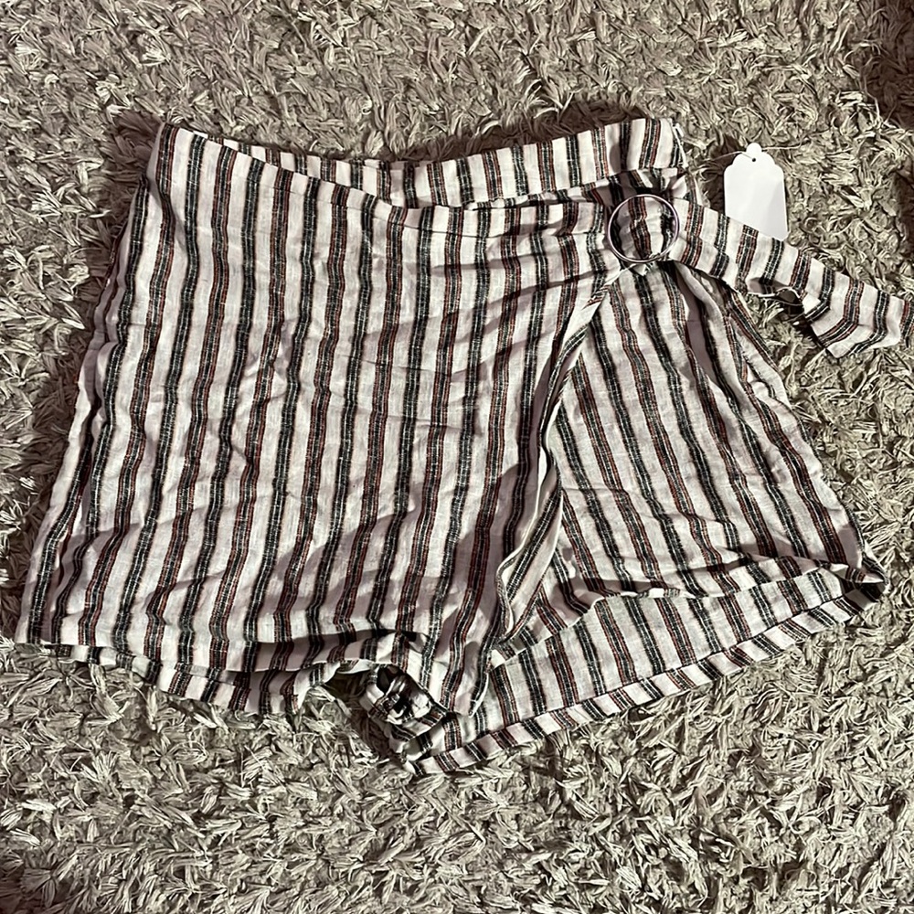 Large gray and orange detailed striped shorts with over lapping layer.